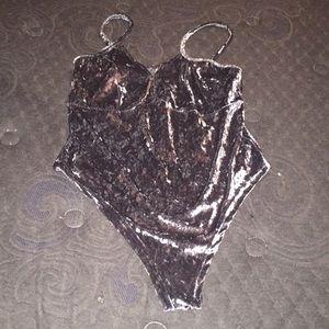 Gray velvet body suit.